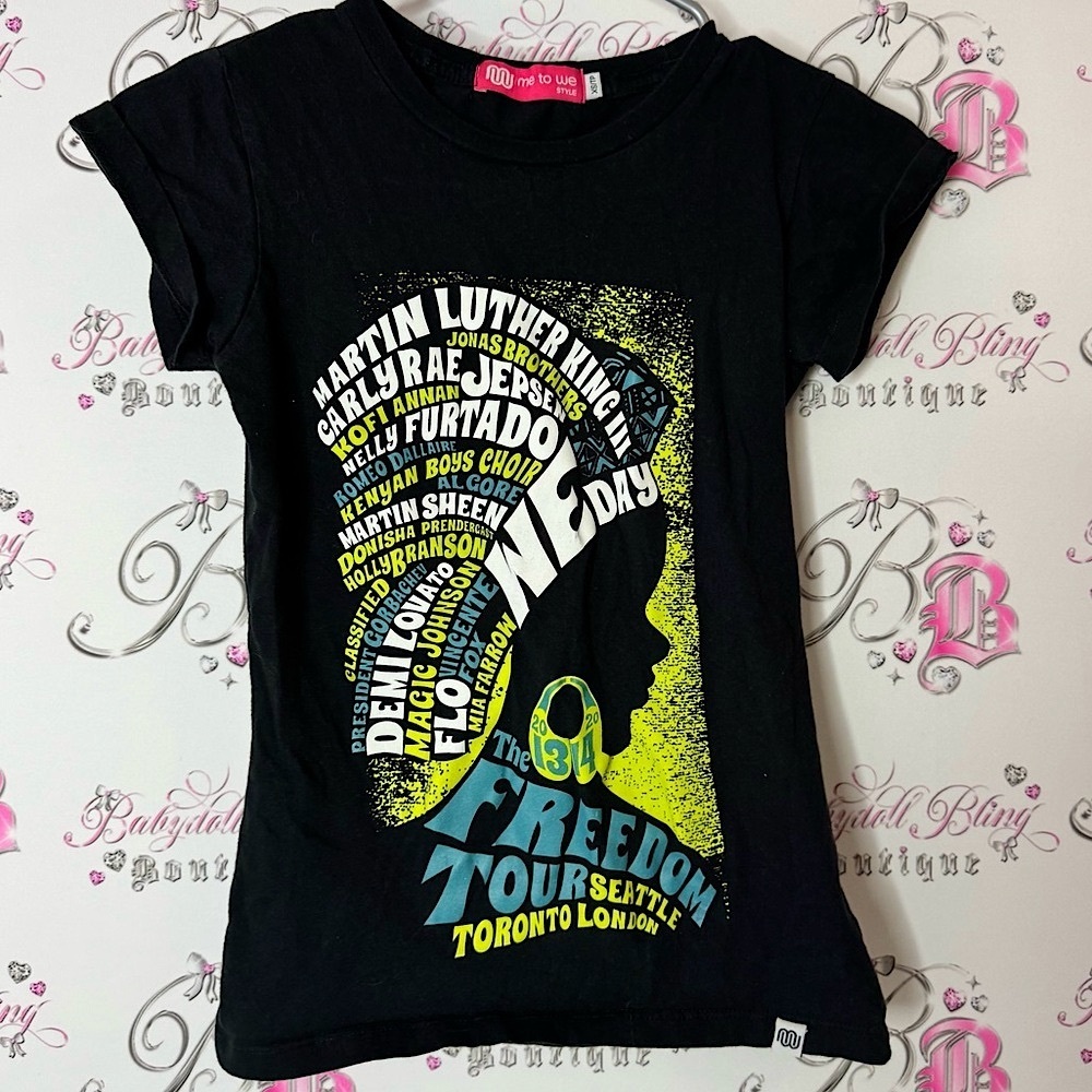 Me to We Black Graphic Tee with Yellow and Blue Accents freedom concert tour